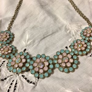Statement necklace with light blue rhinestones.